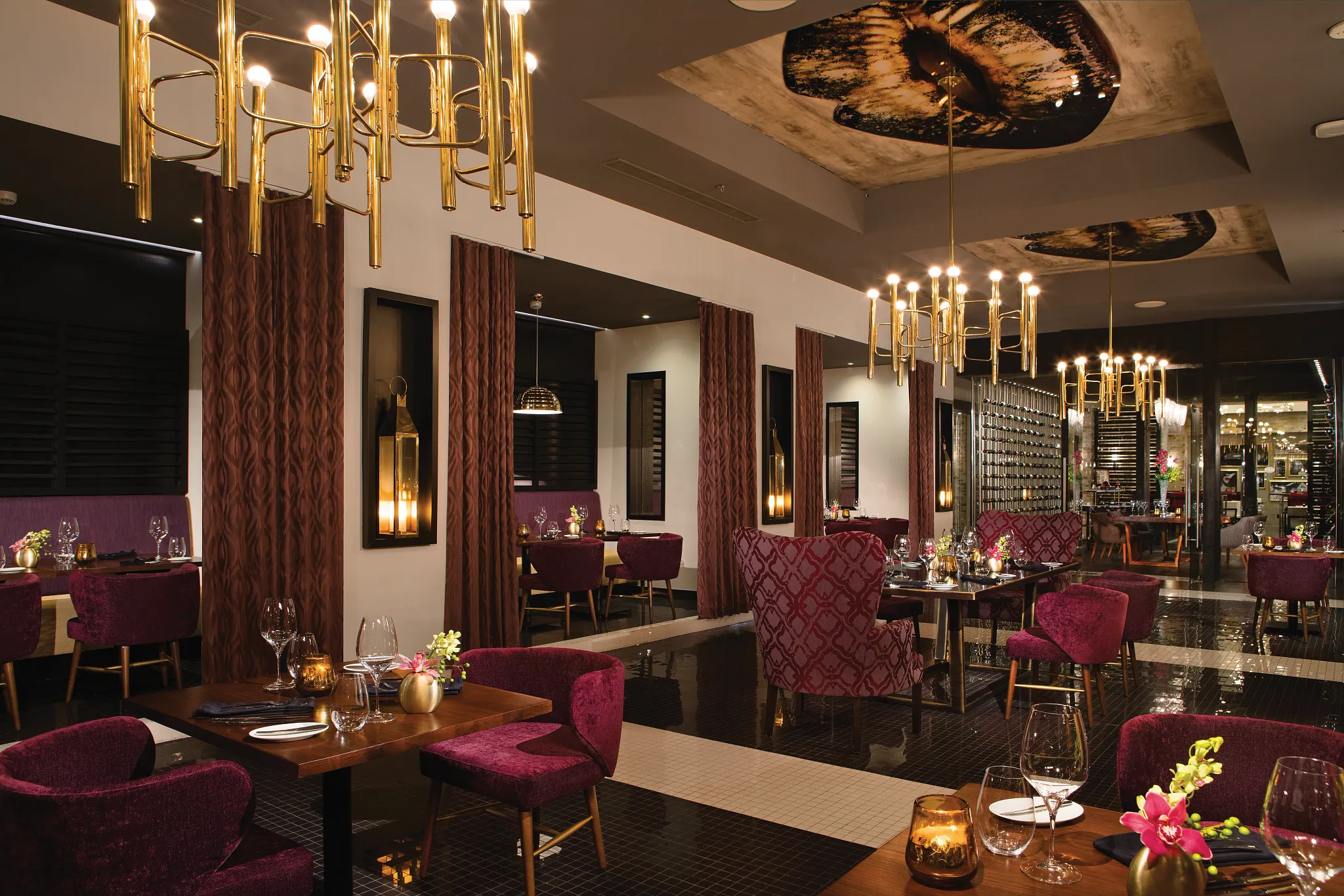 Coquette French restaurant at Secrets Riviera Cancun featuring elegant dining room, velvet chairs, gold chandeliers, and romantic ambiance.