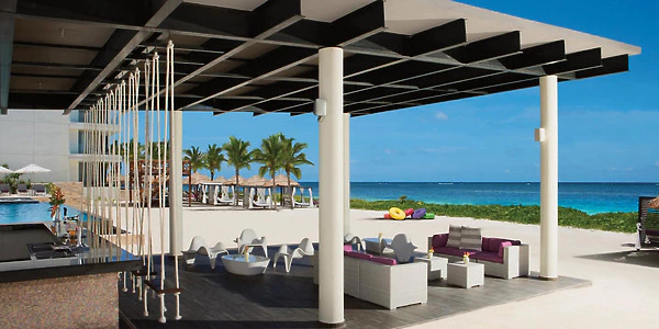 Foam Bar beachfront lounge setup overlooking the Caribbean Sea at Secrets Riviera Cancun