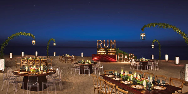Preferred Beach wedding reception setup at night at Secrets Riviera Cancun