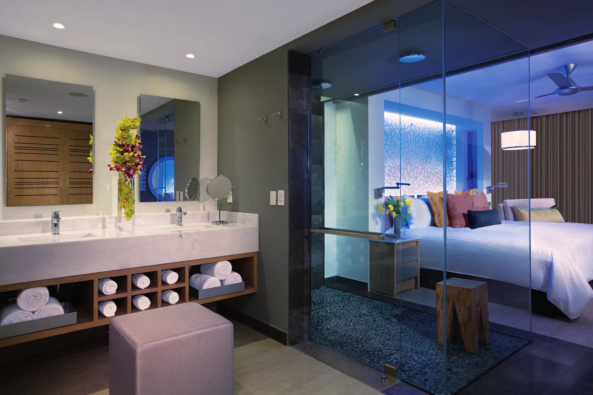 Preferred Club Junior Suite Ocean Front bathroom with dual vanity and glass rain shower at Secrets Riviera Cancun.