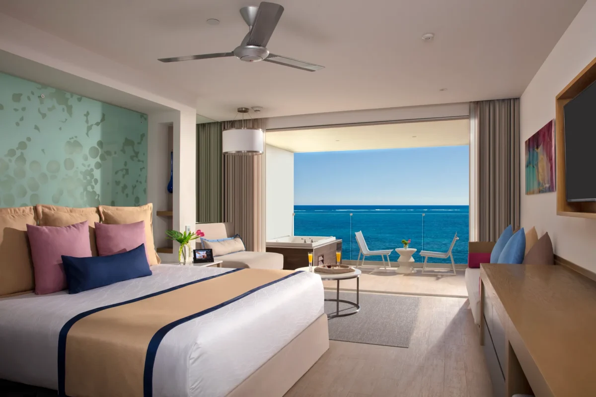 Preferred Club Junior Suite Ocean Front with king bed and private balcony hot tub at Secrets Riviera Cancun Resort & Spa.