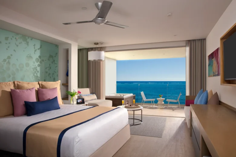Preferred Club Junior Suite Ocean Front with king bed and private balcony hot tub at Secrets Riviera Cancun Resort & Spa.