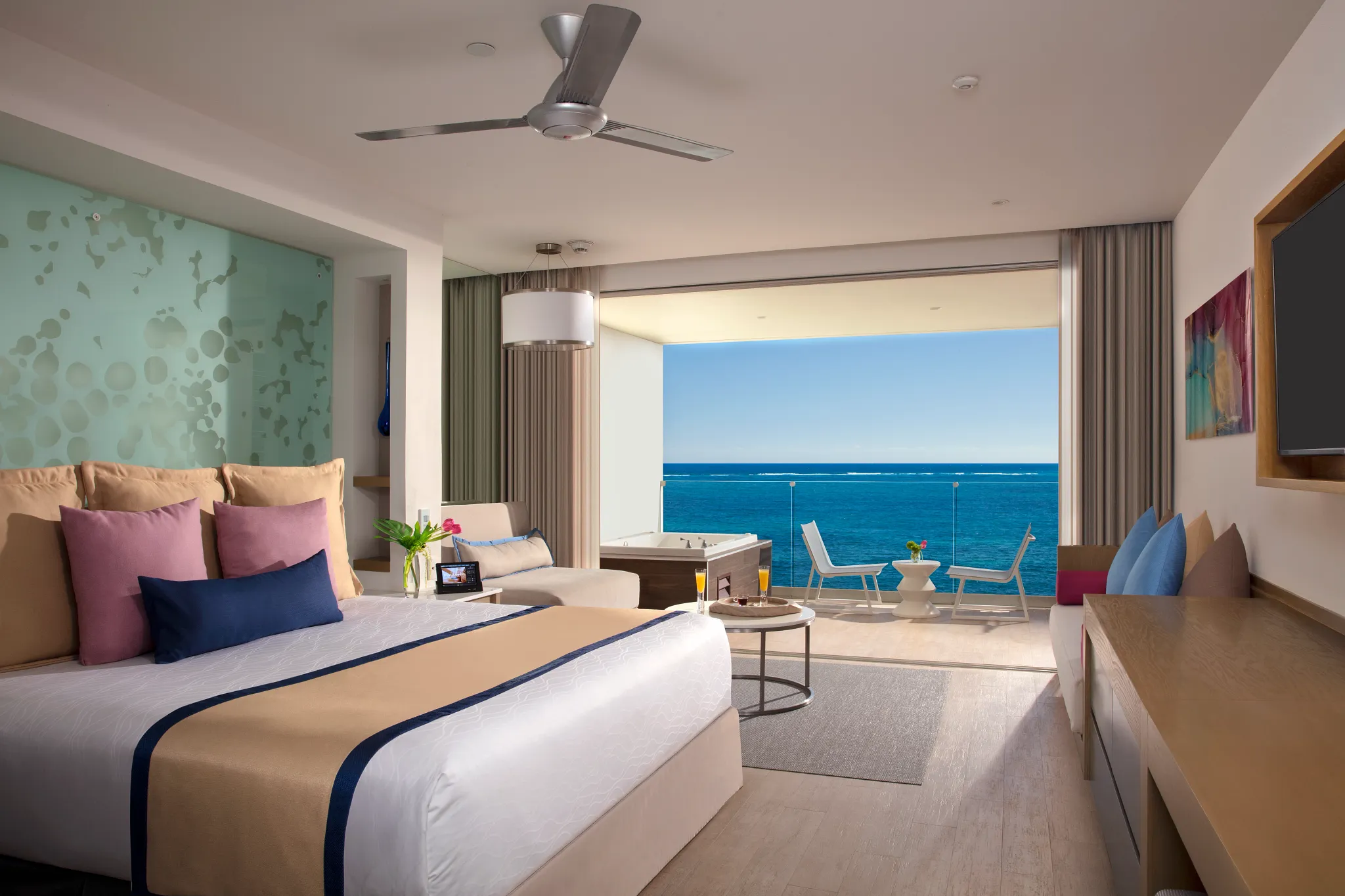 Preferred Club Junior Suite Ocean Front with king bed and private balcony hot tub at Secrets Riviera Cancun Resort & Spa.