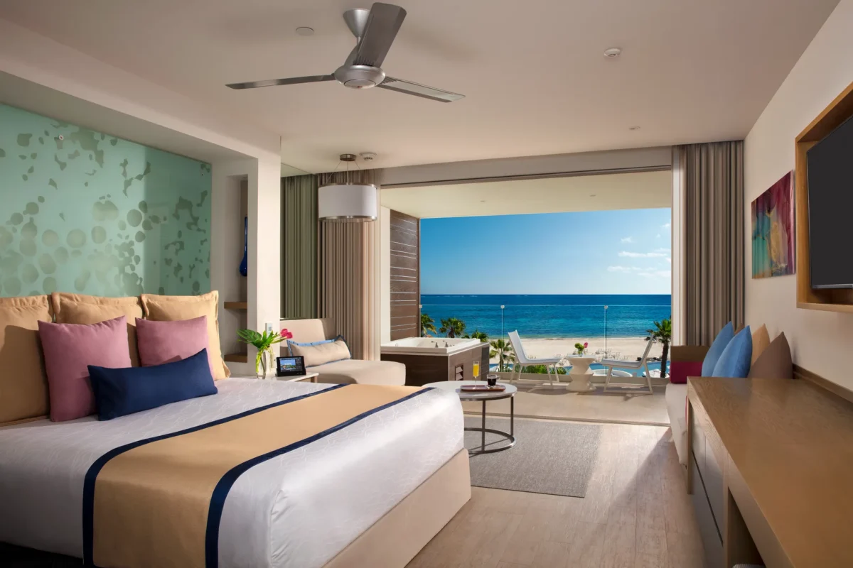 Preferred Club Junior Suite Ocean View with king bed and private balcony hot tub at Secrets Riviera Cancun Resort & Spa.
