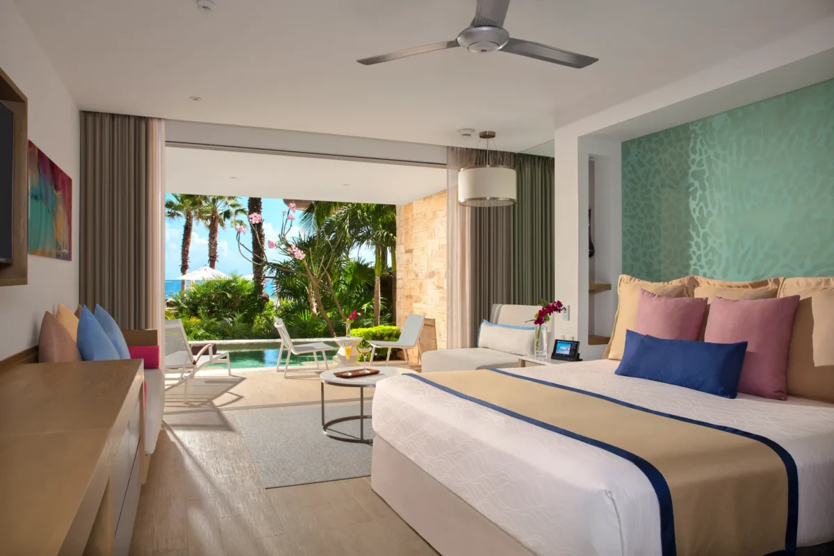 Preferred Club Junior Suite Swim Out Tropical View with king bed and private terrace pool access at Secrets Riviera Cancun Resort & Spa.