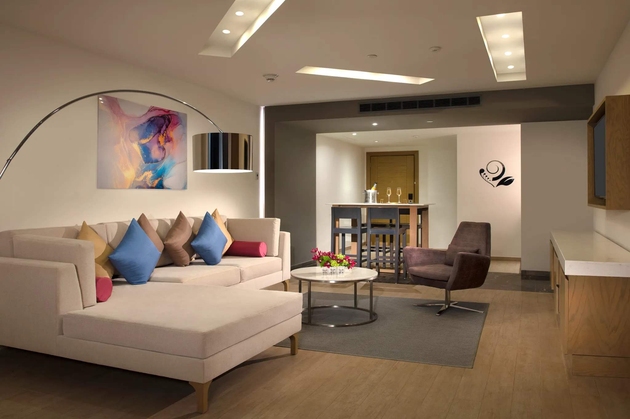 Preferred Club Master Suite Ocean Front separate living room with modern seating at Secrets Riviera Cancun.