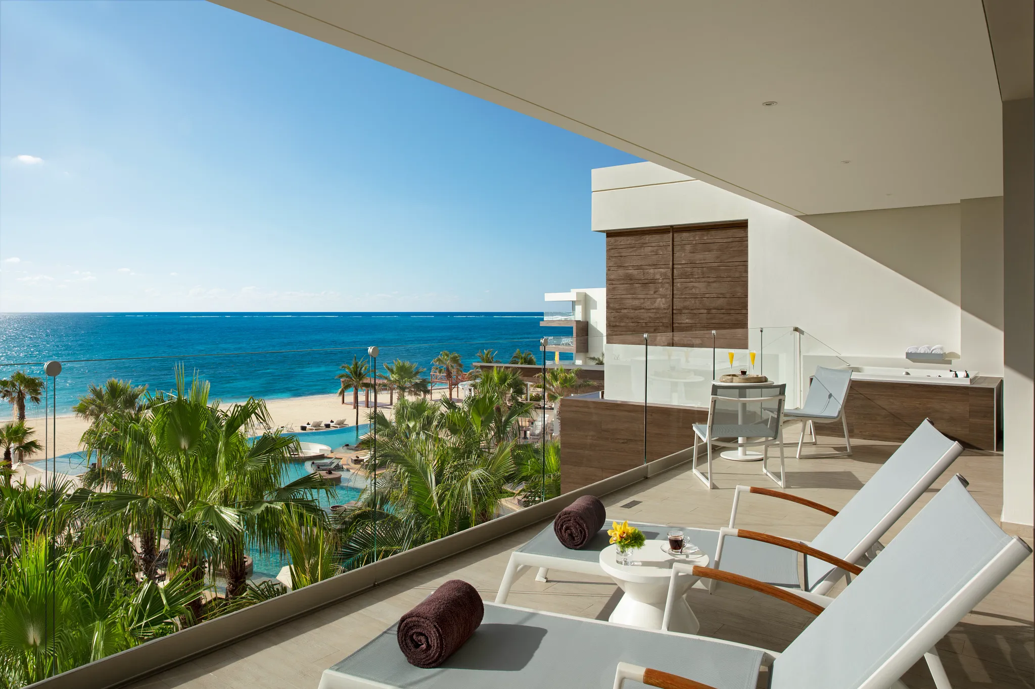 Preferred Club Master Suite Ocean View terrace with hot tub overlooking the Caribbean Sea at Secrets Riviera Cancun.