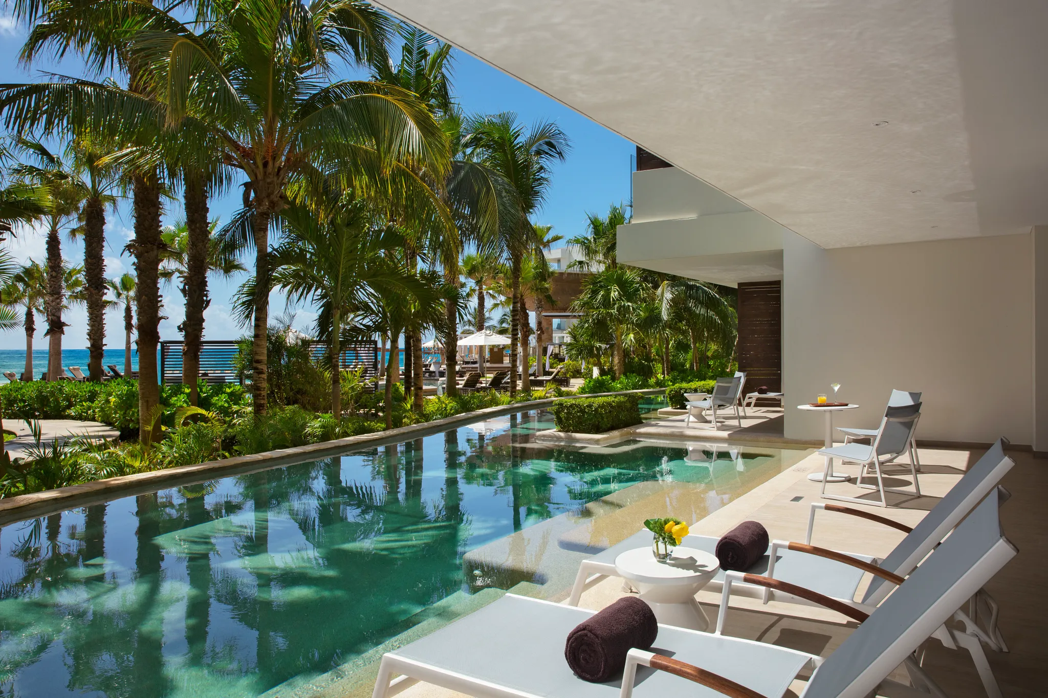 Preferred Club Master Suite Swim Out Tropical View terrace with direct swim-up pool access at Secrets Riviera Cancun.