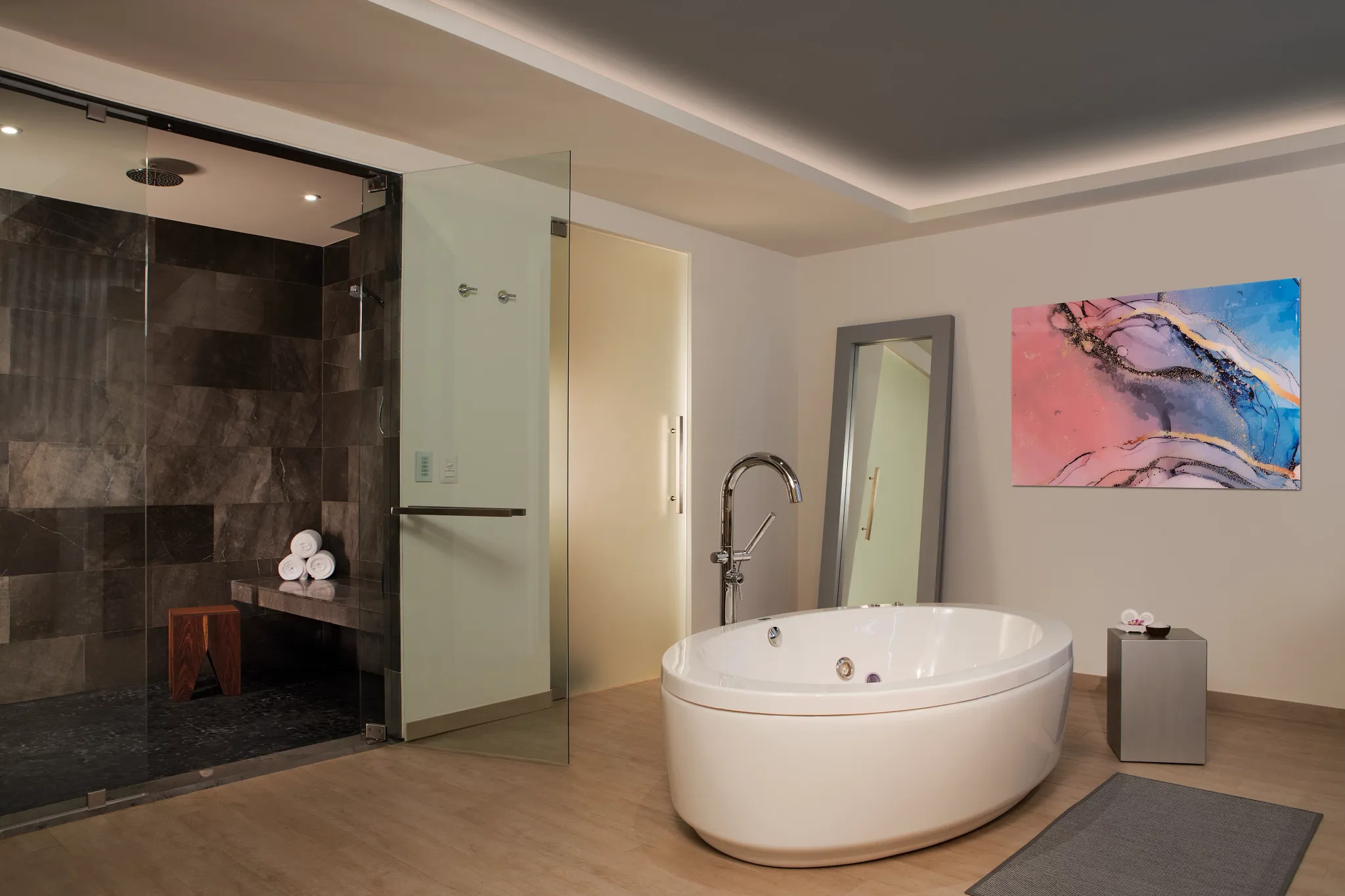 Preferred Club Presidential Suite Ocean Front bathroom with rain shower and hot tub at Secrets Riviera Cancun.