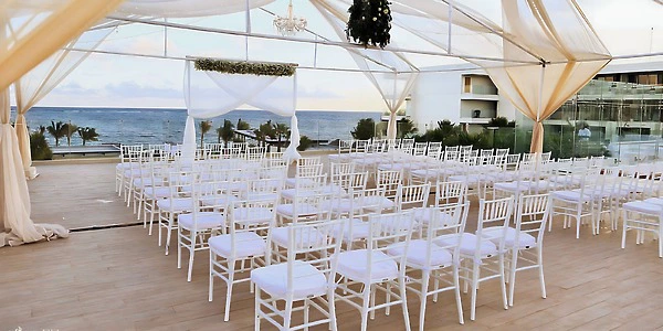 Purple Rooftop terrace ceremony setup with ocean views at Secrets Riviera Cancun