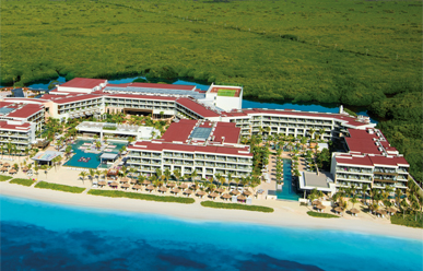 Breathless Riviera Cancun adults-only all-inclusive resort with vibrant pool scene, social atmosphere, and beachfront energy near Puerto Morelos.