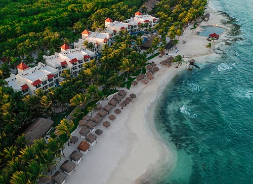 El Dorado Royale adults-only all-inclusive resort with thatched-roof casitas, tropical gardens, and romantic beachfront setting on the Riviera Maya.