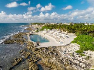 TRS Yucatan Hotel adults-only luxury all-inclusive resort with modern architecture, private pools, and premium service in Riviera Maya.