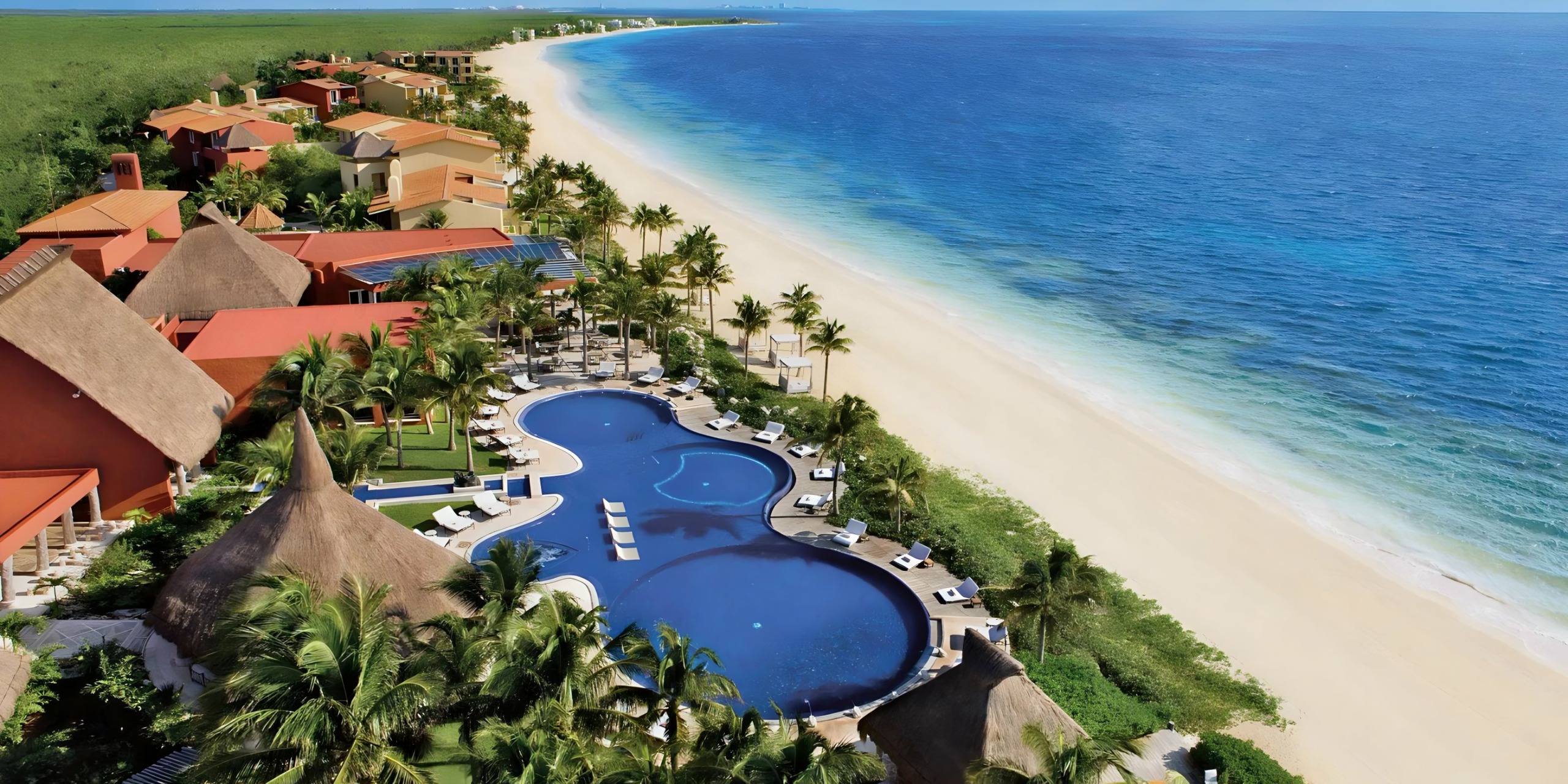 Zoëtry Paraiso de la Bonita Riviera Maya boutique wellness resort with thatched-roof villas, turquoise waters, and holistic spa experiences.